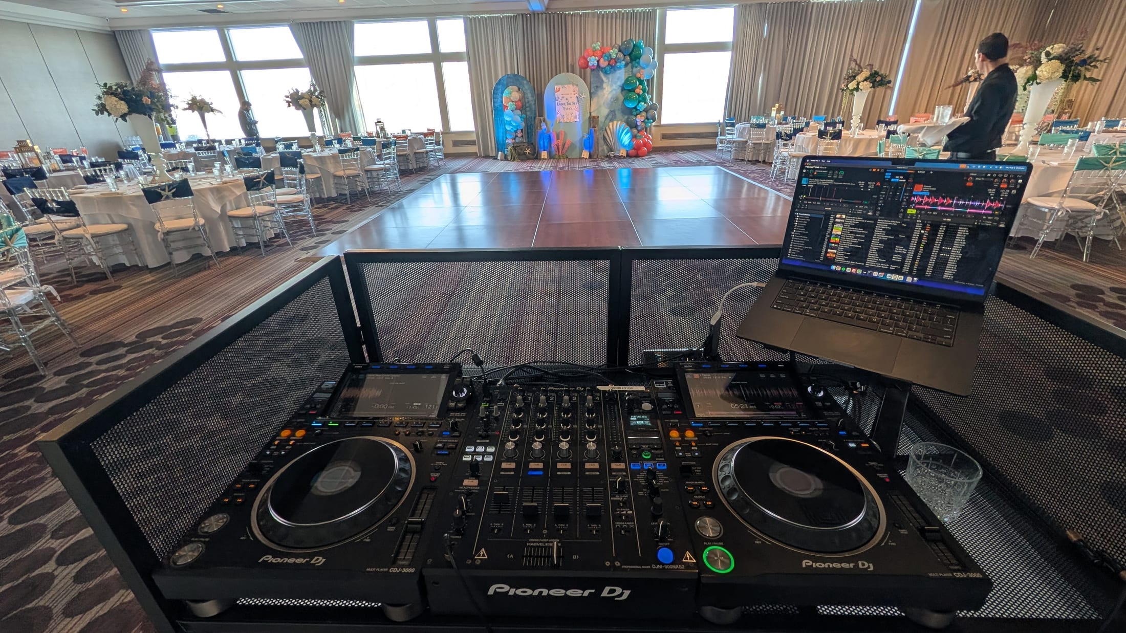 Pioneer CDJ-3000 equipment facing a ballroom dance floor