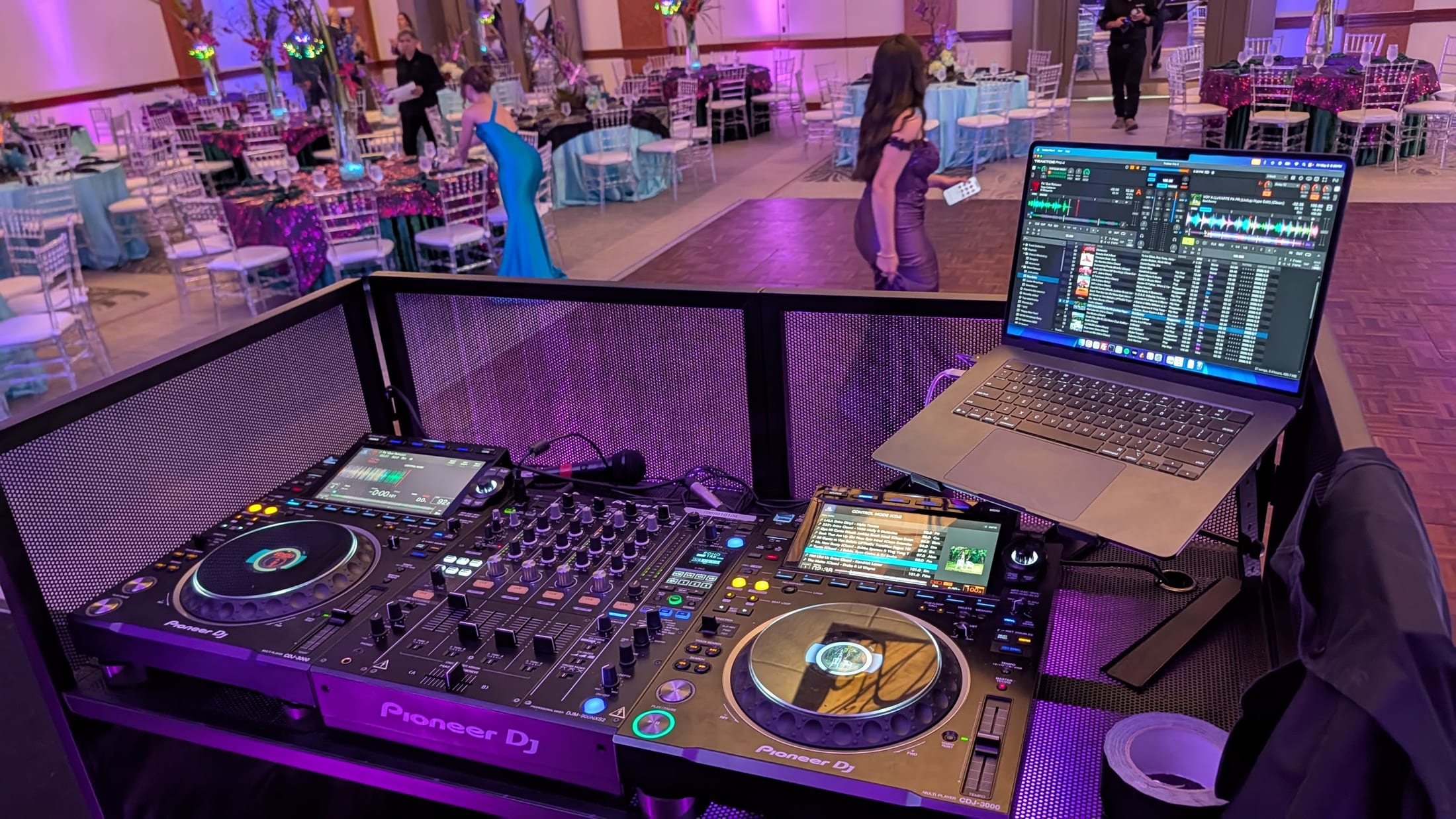 Pioneer DJ booth overlooking a ballroom dance floor