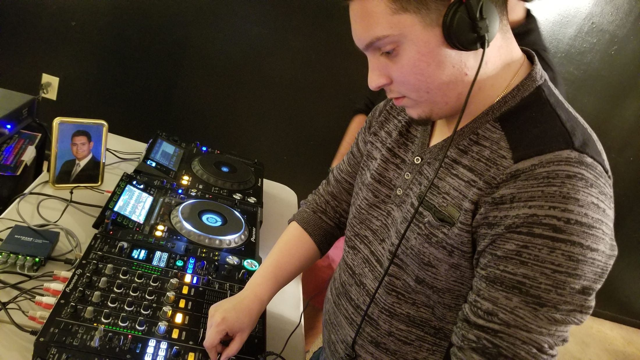 Student practicing on professional Pioneer DJ equipment during a private lesson