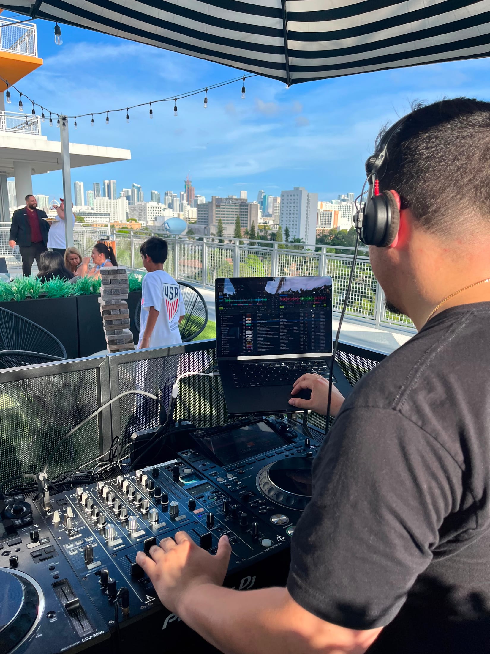 PSYBER DJ performing at a Miami rooftop event