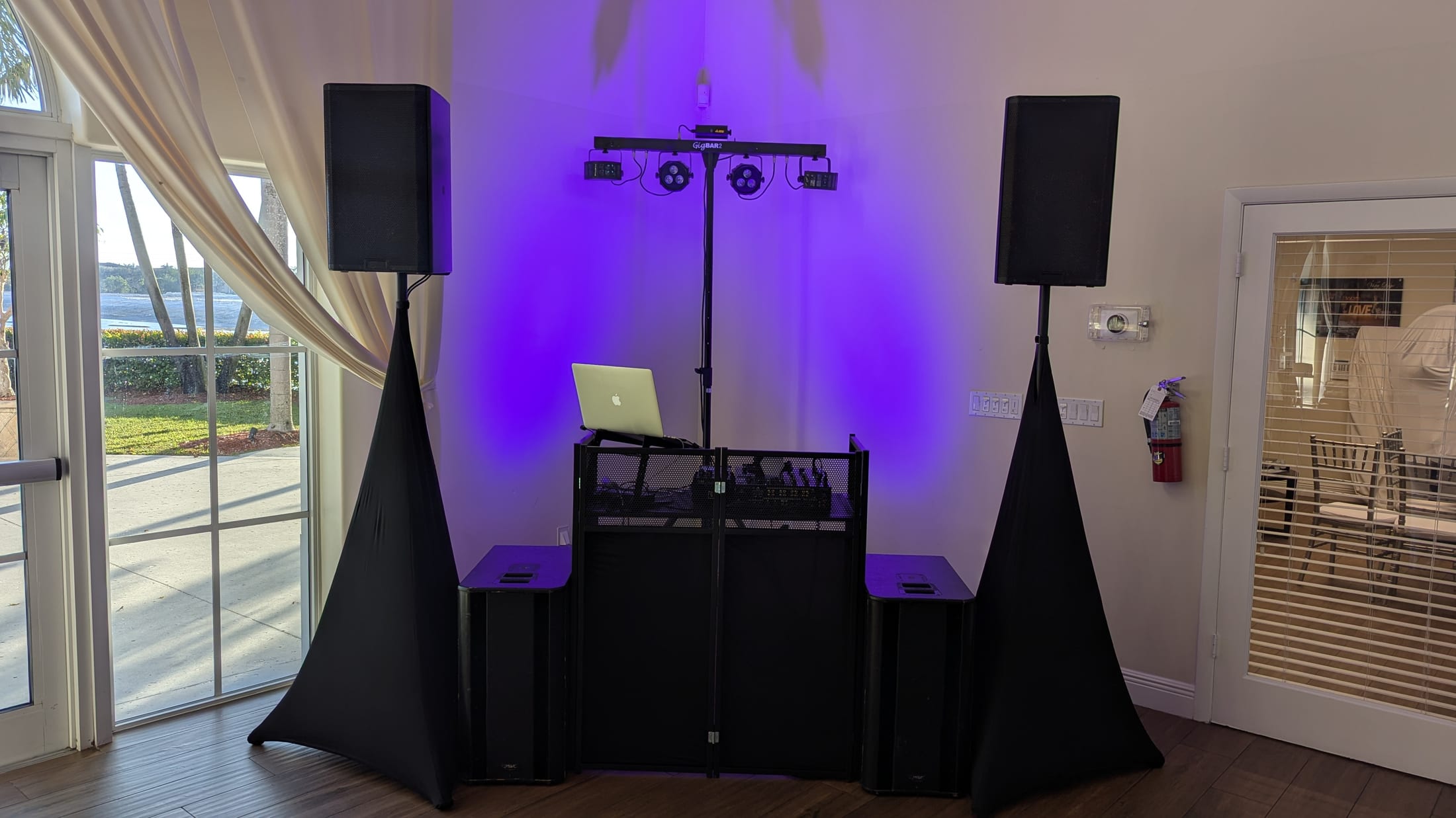 Complete DJ booth with dual QSC speakers and subwoofers