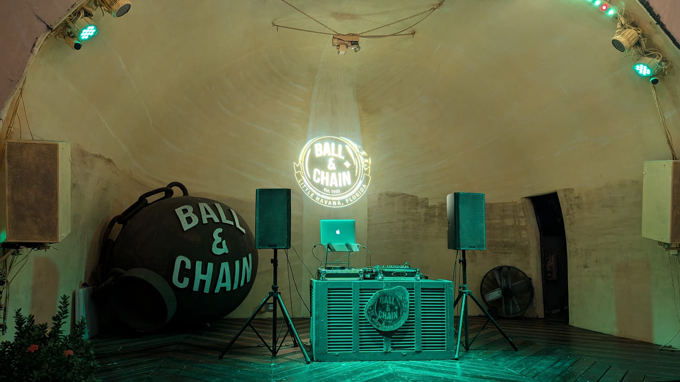 Professional QSC speaker and DJ booth setup at a Miami venue